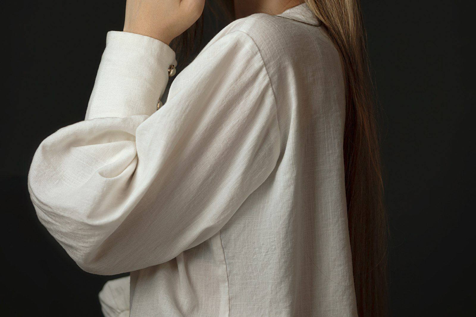 A cropped detail of fabric and hands in motion.