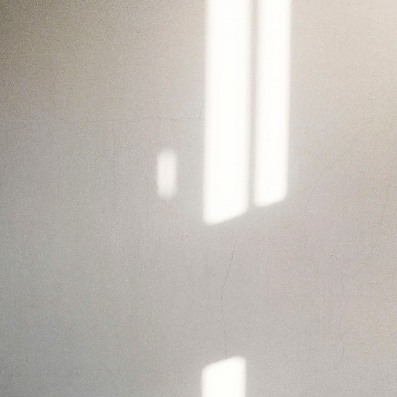 A square still of glass and reflection.